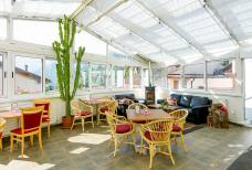 Aparthotel Das Moriggl - Wintergarten und Terrasse